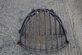 A pair of wrought iron wall-mounted corner hay racks or feeders. H75cm W90cm approx. All items in