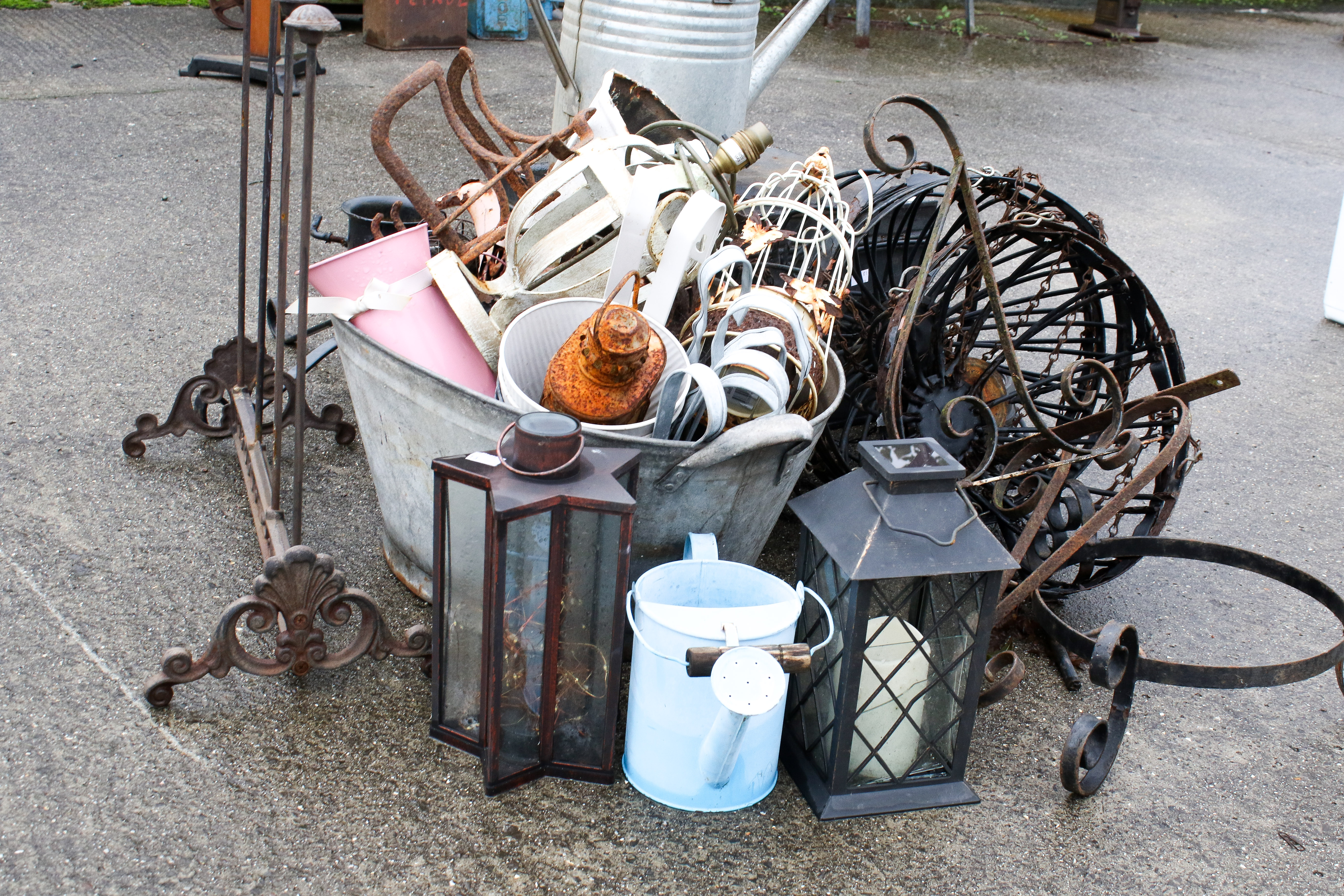An assortment of garden metalwares. To include a galvanised watering can, hanging baskets, wall - Image 2 of 2