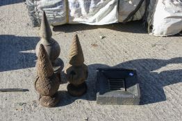 Three vintage telegraph pole finials and a drain cover