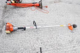 A Victa VS20 petrol-powered garden strimmer. L180cm. All items in this auction are sold as seen,