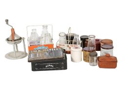 A collection of milk bottles and storage jars and tins. To include a Jack Daniels tin, a Cropwell