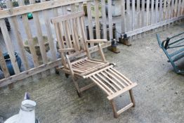 A teak folding garden steamer chair or sun lounger. H90cm L140cm W55cm. All items in this auction