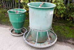 An Osborne Big Wheel pig feeder and a similar unbranded example. Both with green reinforced