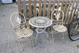 A garden bistro table and two chairs set. Table diameter 61cm All items in this auction are sold