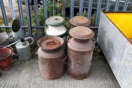 A group of four assorted milk churns. Max. H70cm All items in this auction are sold as seen, We