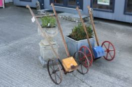 Two vintage seed drills. All items in this auction are sold as seen, We are unable to provide