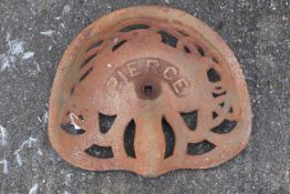 A green cast iron Pierce tractor seat. Marked 'M103' to the underside. W42cm D48cm. All items in