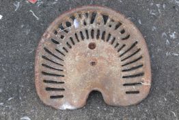 A cast iron Howard tractor seat. Marked 'GP2' to the seat. W42cm D37cm. All items in this auction