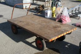 A vintage pull trolley barrow with solid tyres. Bed size 200cm x 101cm All items in this auction are