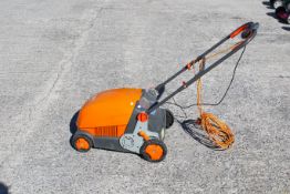 An electric Flymo Lawnrake Compact 3400. L70cm W48cm H93cm.