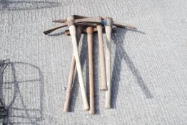 A group of five assorted vintage pickaxes. All items in this auction are sold as seen, We are unable