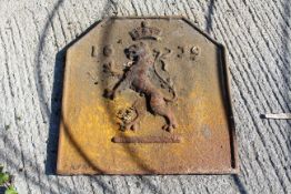 Iron fireback depicting an English Royal Lion and Crown with date 1639.