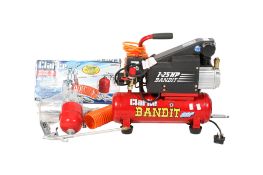 A Clarke Air 1.25HP Bandit electric air compressor. Together with spray and nail gun attachments.