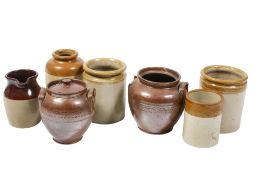 A collection of seven assorted saltglazed pottery items mostly storage jars. Max. H21cm All items in