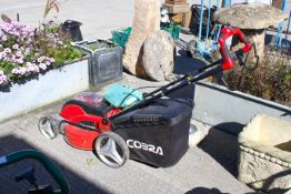 A Cobra cordless lawn mower, MX46S. With 2 batteries and a charger All items in this auction are