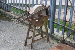 A vintage sharpening stone wheel in a metal frame, H86cm All items in this auction are sold as seen,