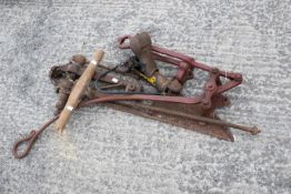 A small group of vintage tools. To include a Dunlop foot pump, an agricultural vice clamp, a hay