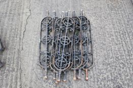 Eight decorative cast iron staircase balusters or spindles. Painted black. H94cm W17cm. All items in