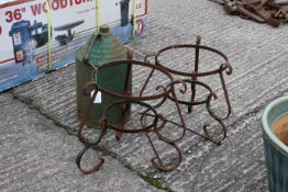 Two metal plant pot stands and a vintage metal can. All painted green. The can H40cm C22cm. All