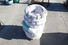 Five reels of reenforced plastic hose. All items in this auction are sold as seen, We are unable