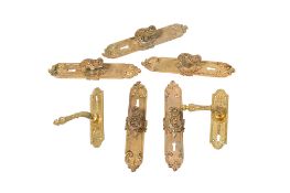 A group of seven gilt brass door handles. All items in this auction are sold as seen, We are