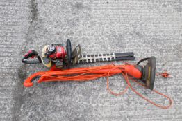 A Kawasaki TG18 petrol-powered hedge trimmer and a Flymo ContourXT electric strimmer. Trimmer