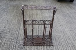 A decorative cast iron boot or shoe rack and scraper. H76cm W64cm D34cm. All items in this auction