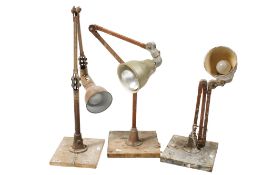 Three industrial adjustable work lights. On square wooden bases All items in this auction are sold