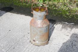 A vintage half-sized milk churn. With lid and handle. H54cm C30cm.
