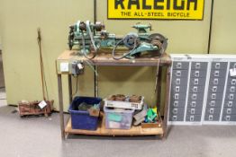 A South Bend single phase metal working engineers' lathe. On a bench with accessories All items in