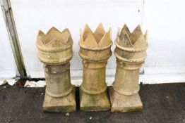 Three reclaimed clay crown-topped chimney pots. One stamped 'Doutlon & Co'. H89cm; bases 35 x