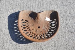 A vintage Victor cast metal tractor seat. All items in this auction are sold as seen, We are