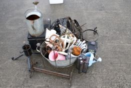 An assortment of garden metalwares. To include a galvanised watering can, hanging baskets, wall