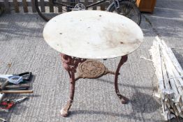 A late Victorian cast iron pub table with mask of 'B.P.' (Baden-Powell). Having later top H71cm