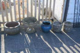 Five assorted garden flower planters.