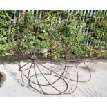 A large wrought iron hanging garden seat frame. Diameter 154cm All items in this auction are sold as