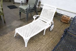 A metal outdoor chaise lounge sunbed chair. With adjustable backrest and wheels. Painted white.