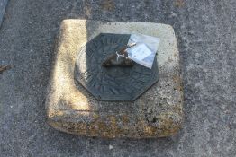 A garden sun dial set on a square stone base H17cm All items in this auction are sold as seen, We
