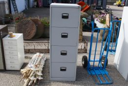 A grey metal four drawer filing cabinet with keys. H132cm All items in this auction are sold as