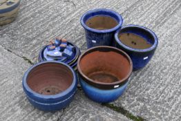 Four blue glazed plant pots, dishes and feet. The tallest H25cm C28cm. All items in this auction are