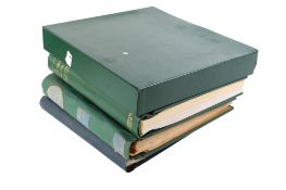 Four assorted stamp albums.