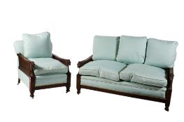 A 20th century carved and stained beechwood two piece bergere suite.