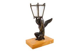 An early 20th century figural table lamp.