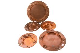 Five Art Nouveau copper dishes.