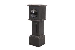 A novelty tabletop pocket watch holder in the form of a long case clock.