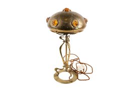 An Art Nouveau brass table lamp.