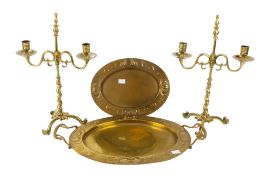 A pair of brass candelabra, brass dish and a twin handled tray.