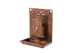 A Newlyn School style copper matchbox holder.