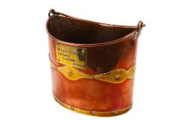 A 19th century brass and copper coal bucket.