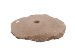 An ancient stone rotary grinding quern. Discovered at Frenchfield swimming pool, Penrith.